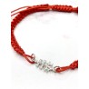 Red Caravaca Cross bracelet made of macramé and silver