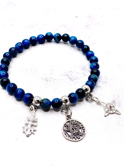 Pulsera triple protección de plata: Tetragramatón, Cruz de Caravaca y San Benito con Ojo de Tigre azul